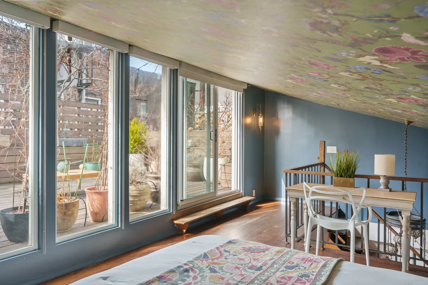 a dining room with furniture and wooden floor