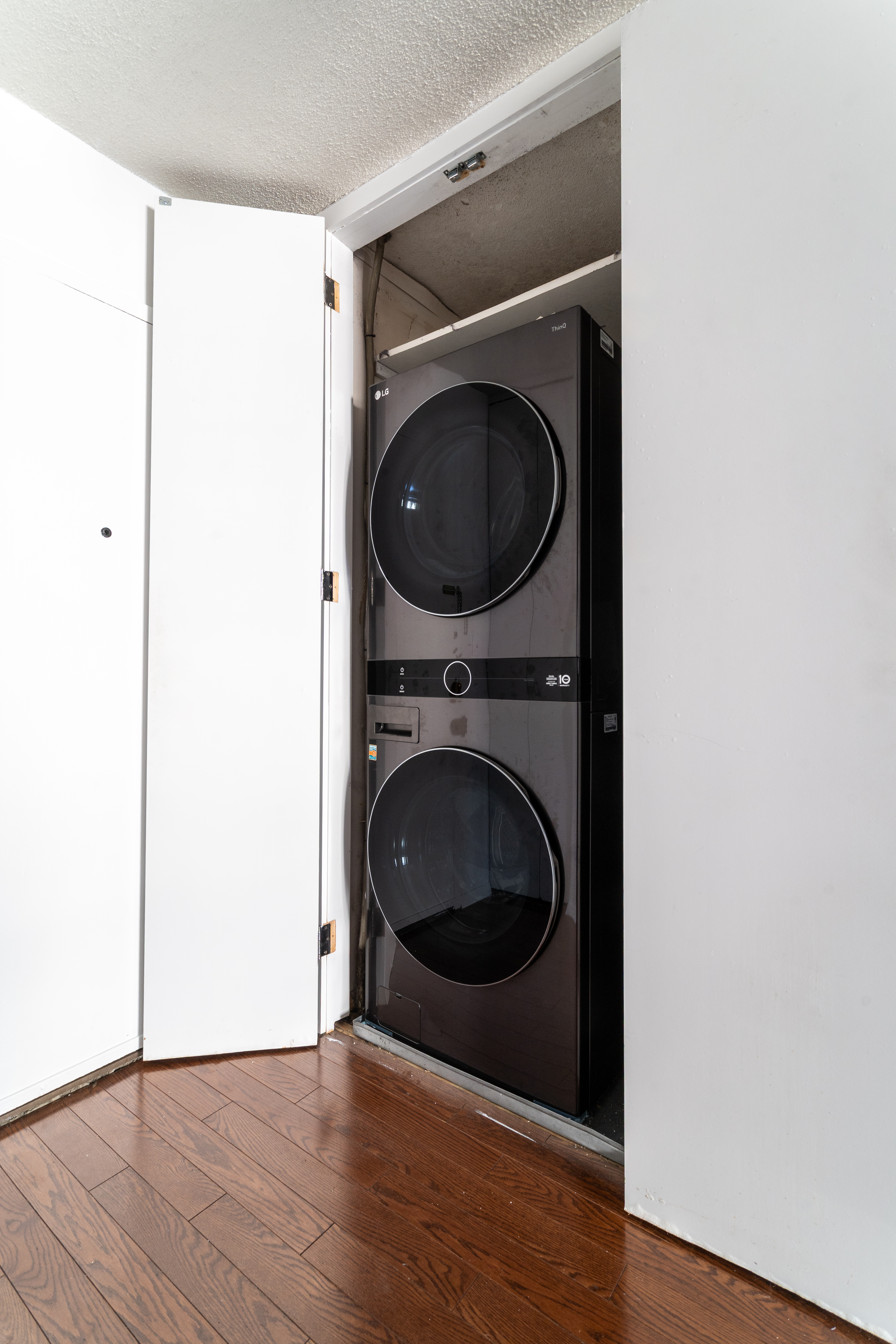 275 West 96th Street, Unit 12B Manhattan, NY 10025 - Photo 8 of 28 a utility room with dryer and washer