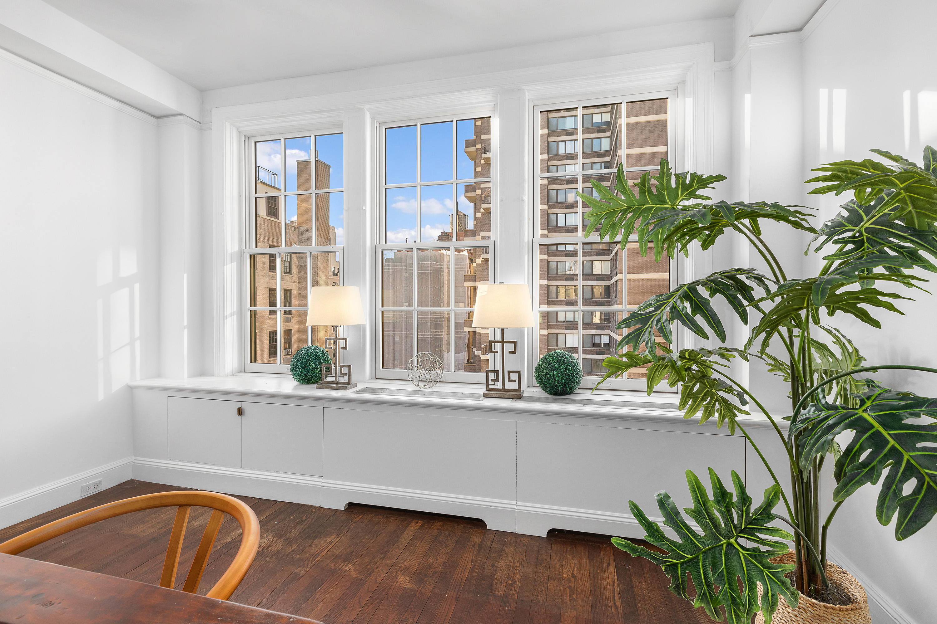 1088 Park Avenue, Unit 15C Manhattan, NY 10128 - Photo 8 of 26 a view of a living room and a potted plant