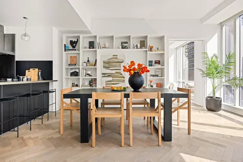 a kitchen with a table and chairs in it