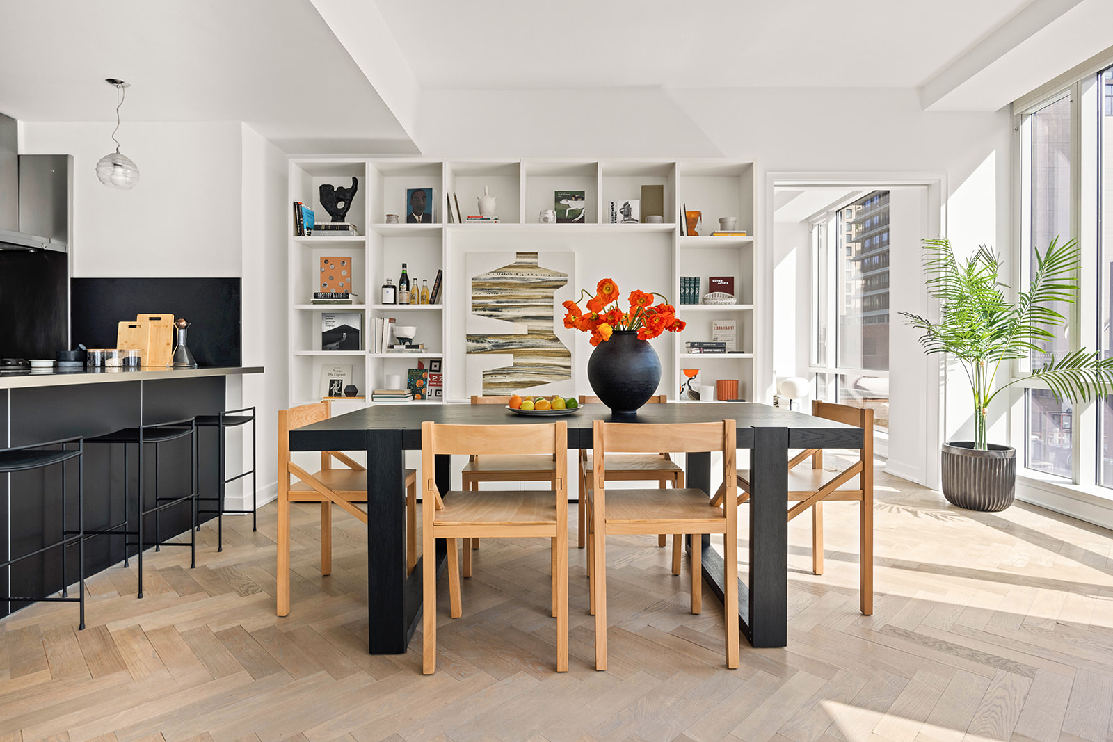 330 Spring Street, Unit 7D Manhattan, NY 10013 - Photo 2 of 11 a kitchen with a table and chairs in it