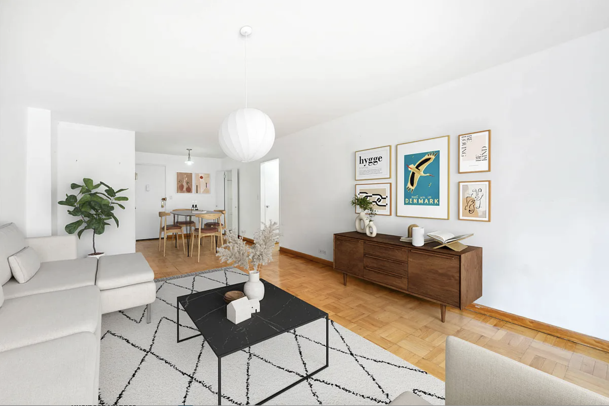 77 West 55th Street, Unit 11G Manhattan, NY 10019 - Photo 2 of 12 a living room with furniture and a wooden floor