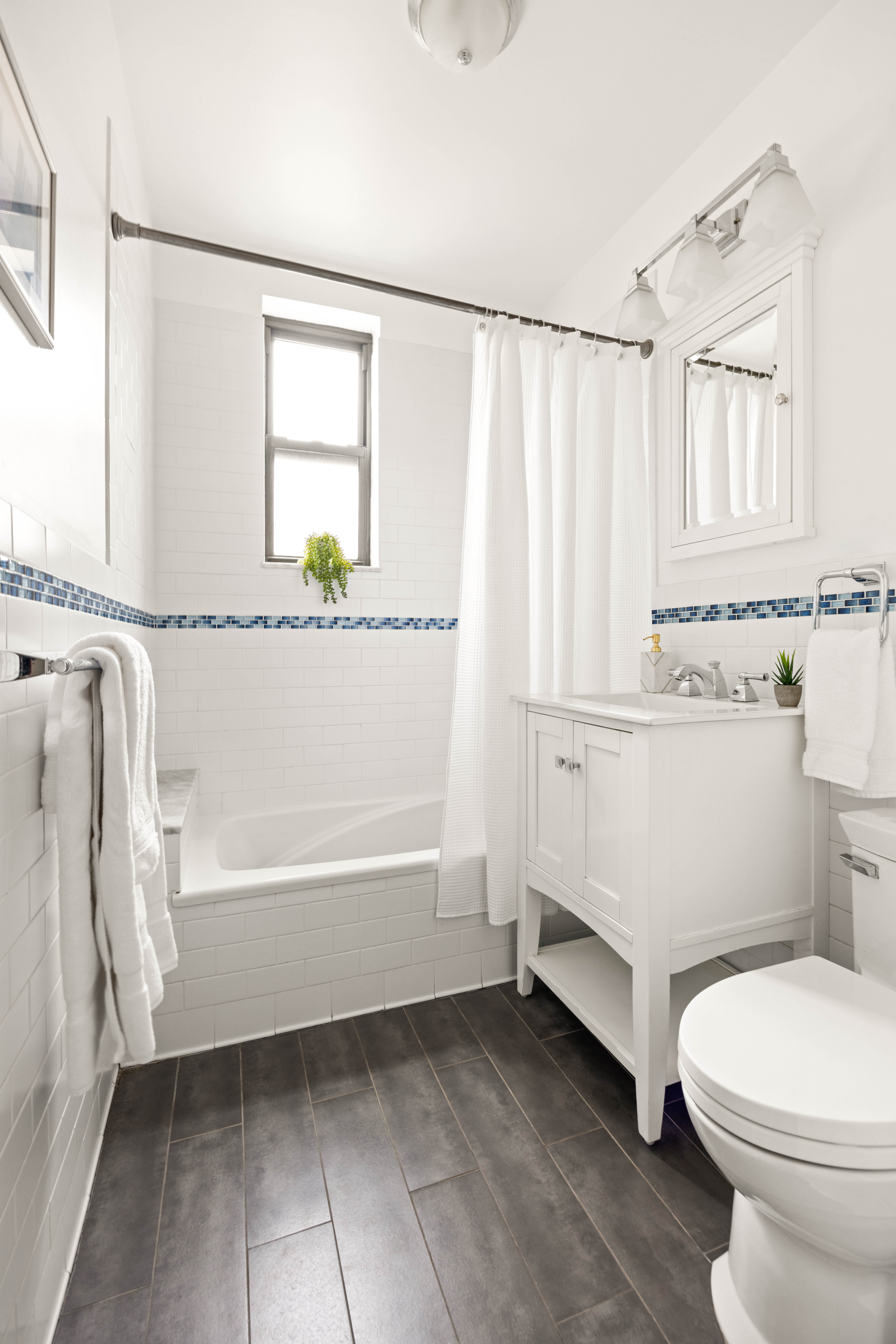 30 Ocean Parkway, Unit 6G Brooklyn, NY 11218 - Photo 12 of 18 a bathroom with a sink a toilet and tub