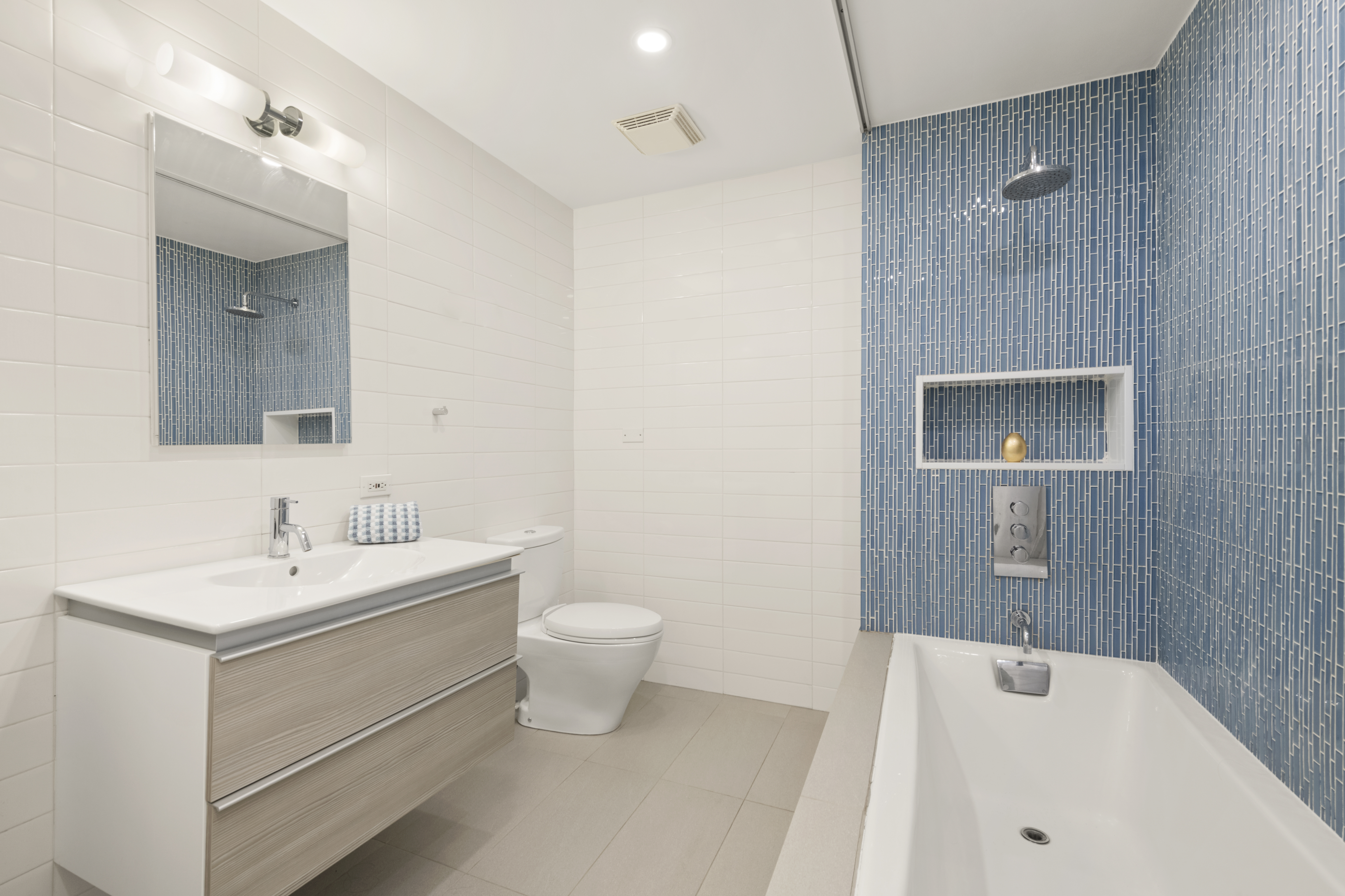 110 Duane Street, Unit 3F Manhattan, NY 10007 - Photo 10 of 14 a bathroom with a sink and a mirror