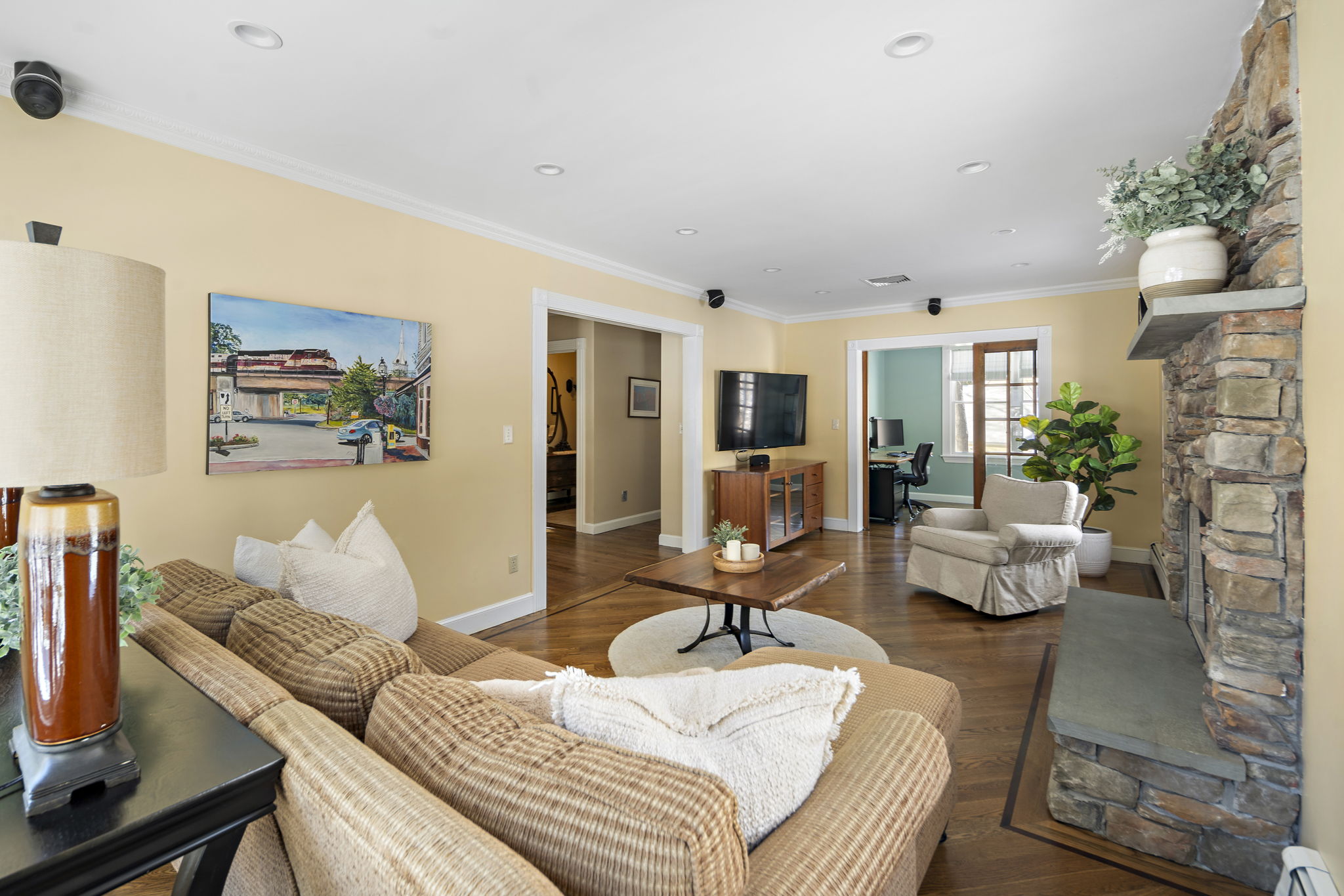 56 Jefferson Road Winchester, MA 01890 - Photo 13 of 26 a bedroom with furniture and a potted plant