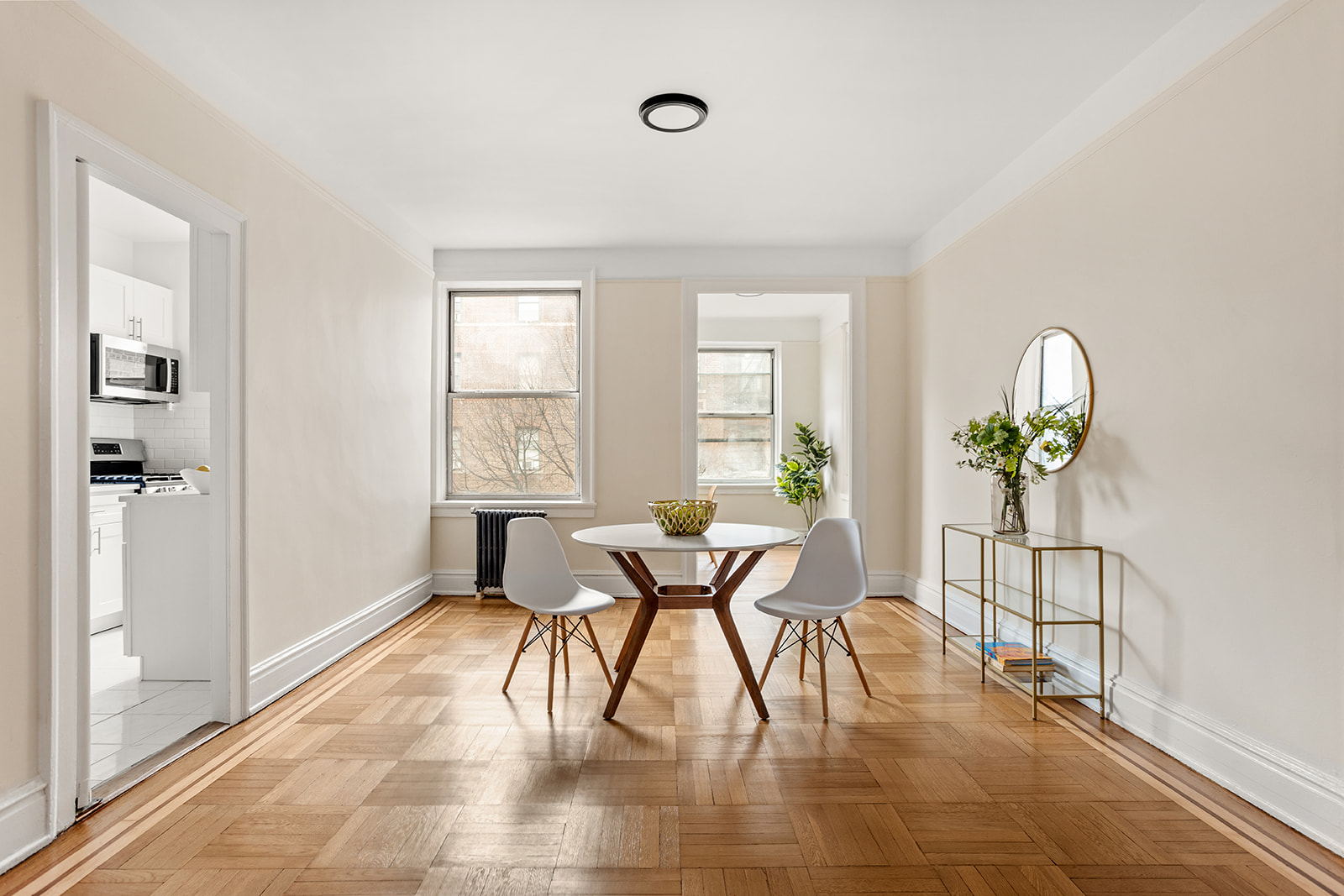 37-16 80th Street, Unit 32 Queens, NY 11372 - Photo 2 of 13 a view of a dining room with furniture and a potted plant