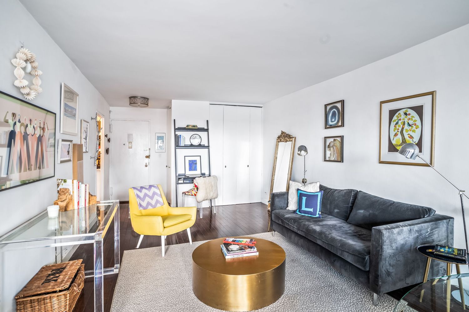 363 East 76th Street, Unit 14E Manhattan, NY 10021 - Photo 2 of 12 a living room with furniture and a rug