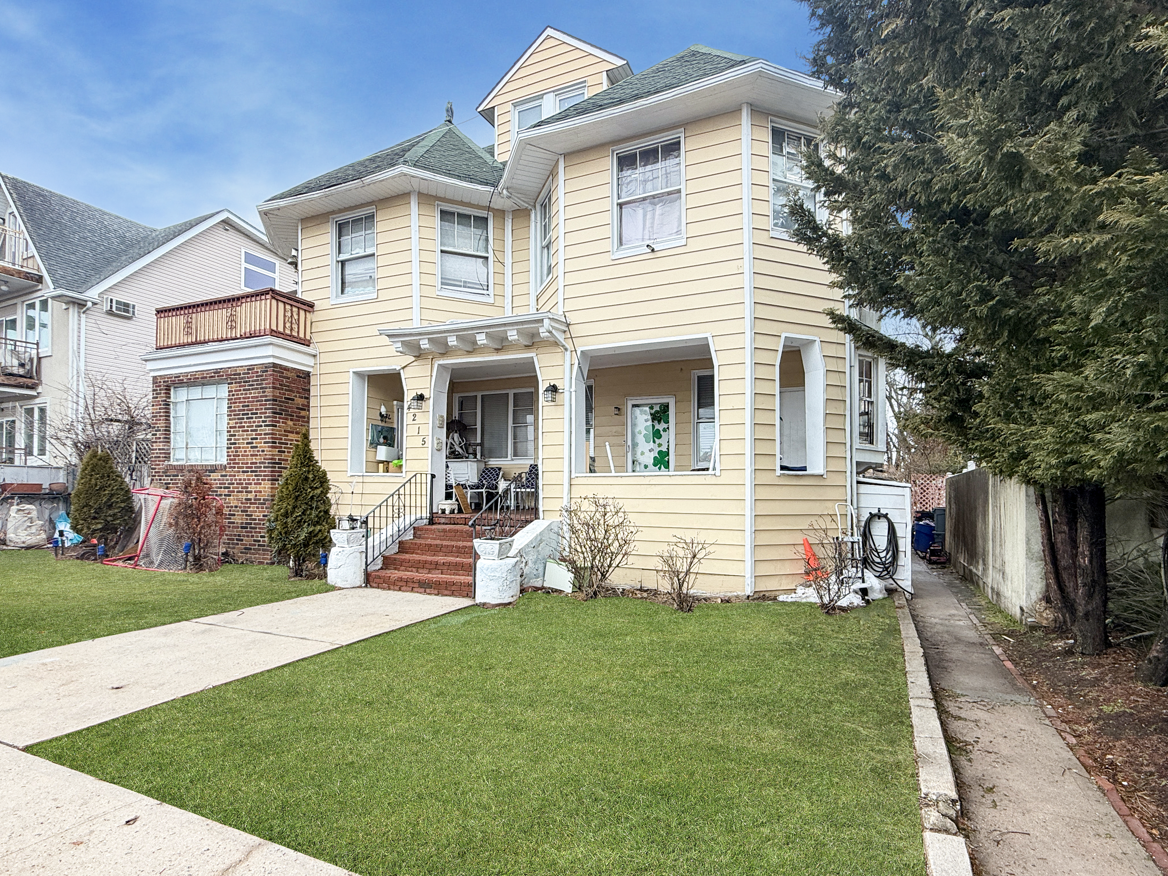 a front view of house with yard and outdoor seating