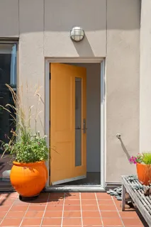a room with a table and potted plant