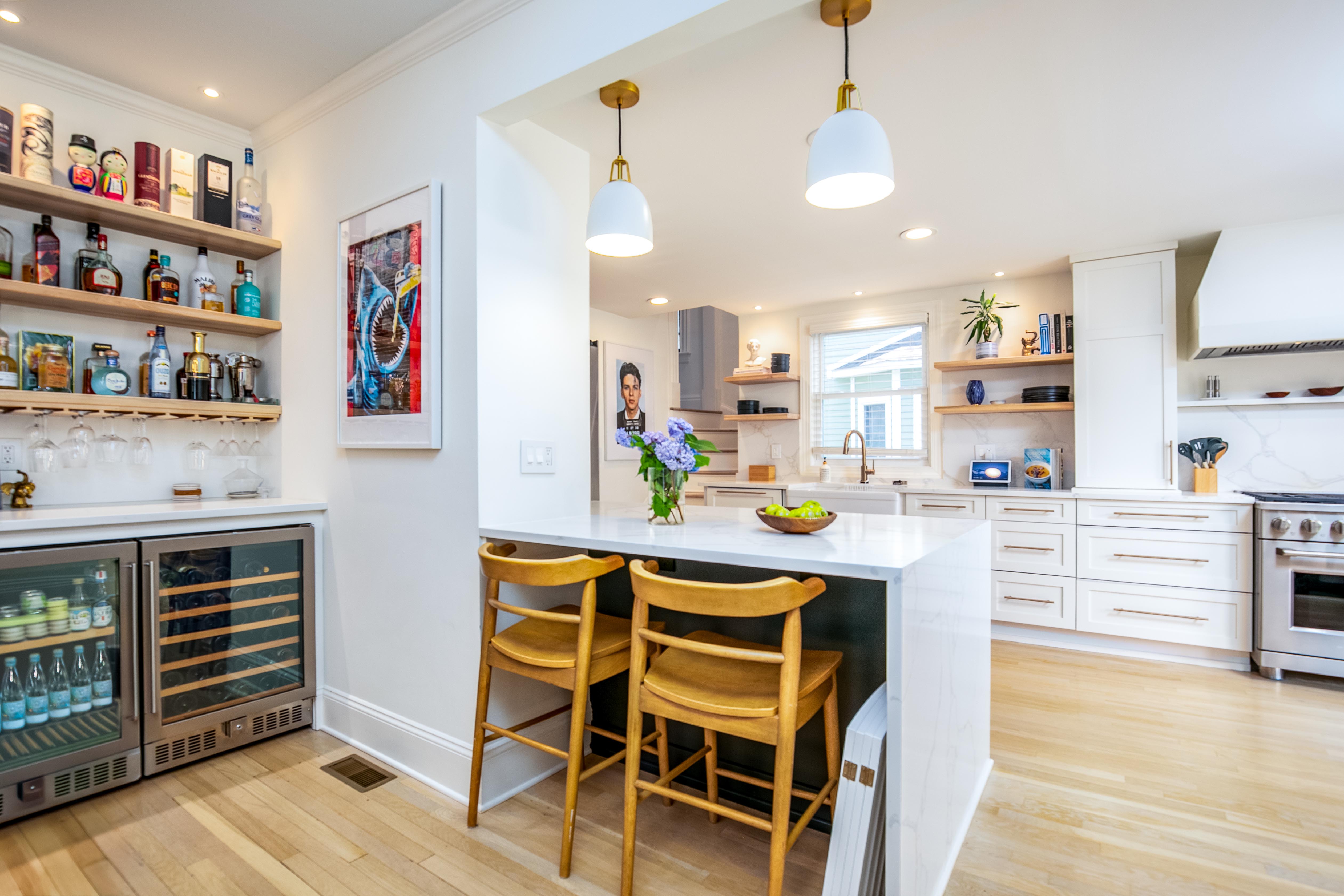 163 Ridge Road Rutherford, NJ 07070 - Photo 16 of 59 a kitchen with a table chairs stove and cabinets