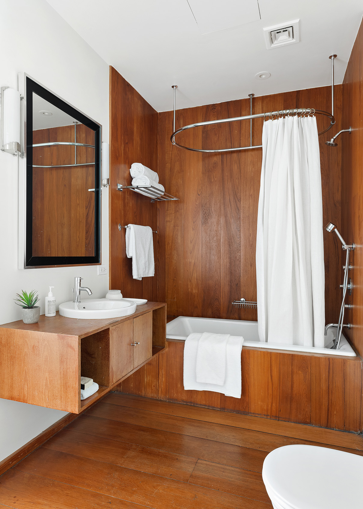 145 6th Avenue, Unit 2B Manhattan, NY 10013 - Photo 22 of 23 a bathroom with a sink toilet and shower