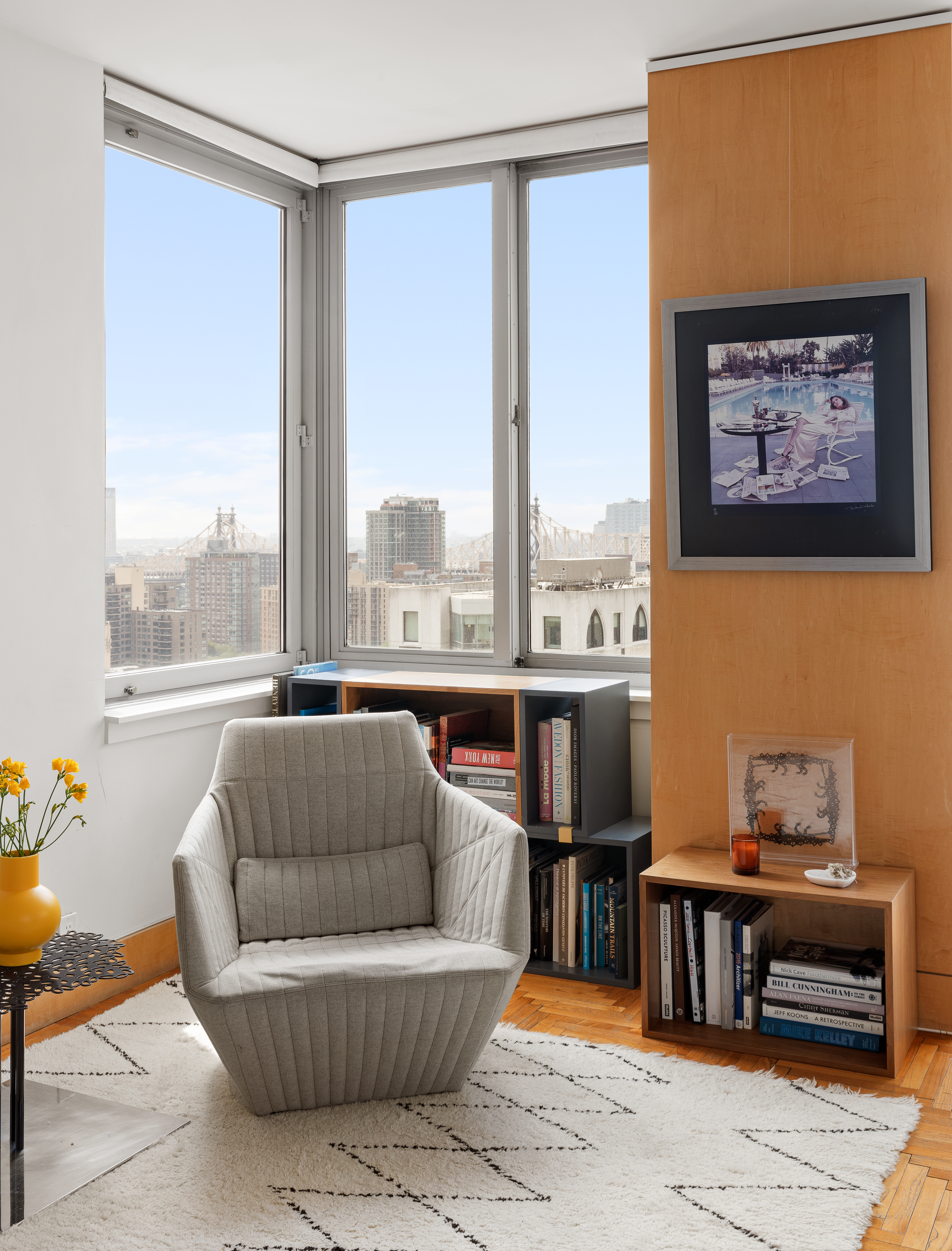 524 East 72nd Street, Unit 28DE Manhattan, NY 10021 - Photo 11 of 14 a living room with furniture a table and a large window