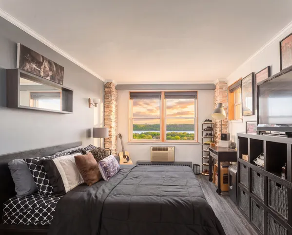 a bed room with a bed and a couch