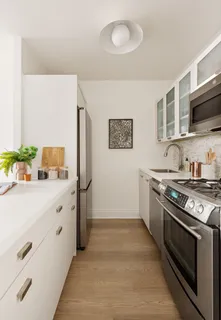 a kitchen with stainless steel appliances a stove and a refrigerator