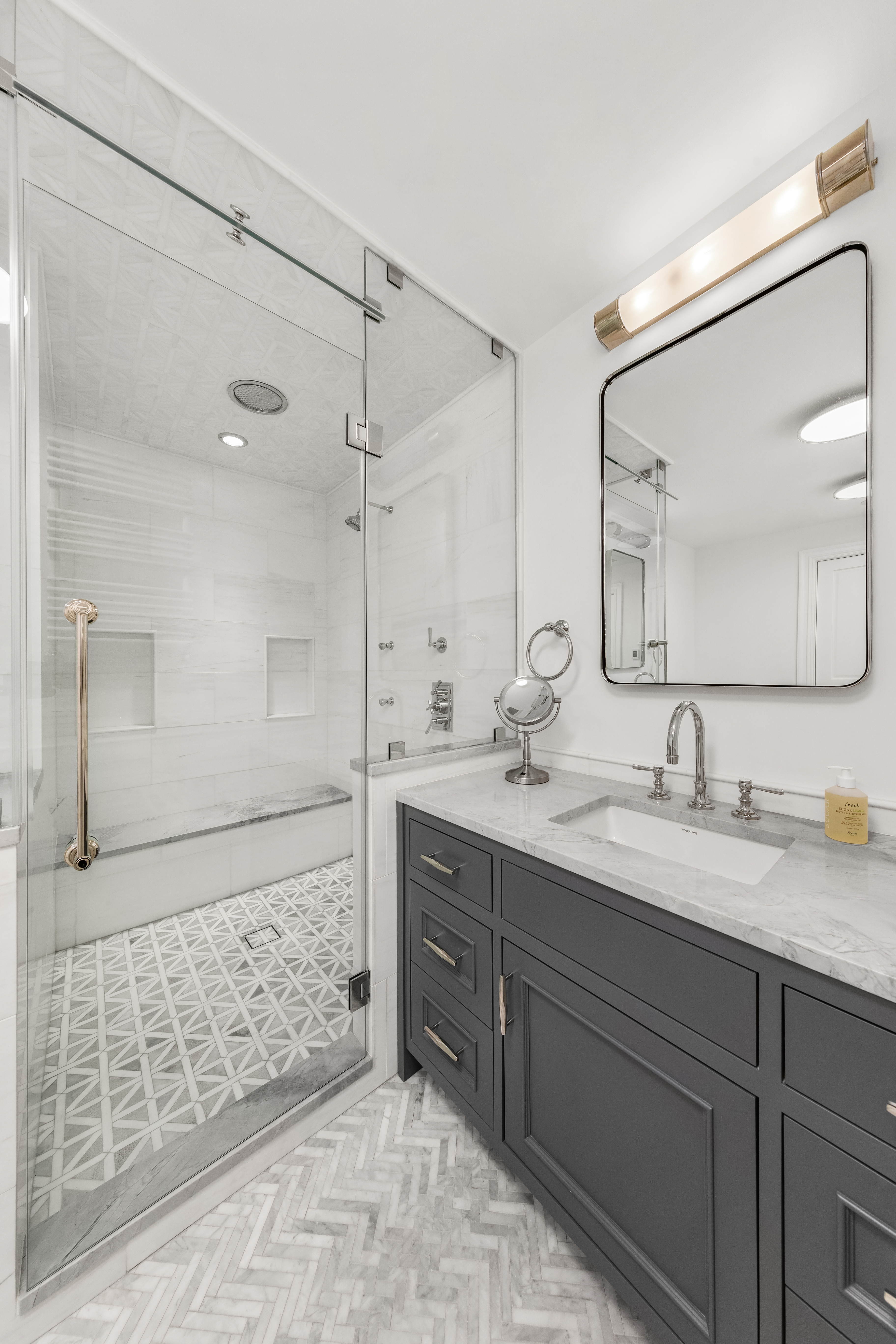 110 West 81st Street Manhattan, NY 10024 - Photo 13 of 30 a bathroom with a double vanity sink mirror and shower