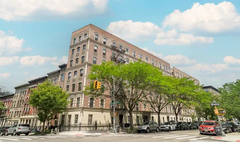 a city street lined with buildings and trees