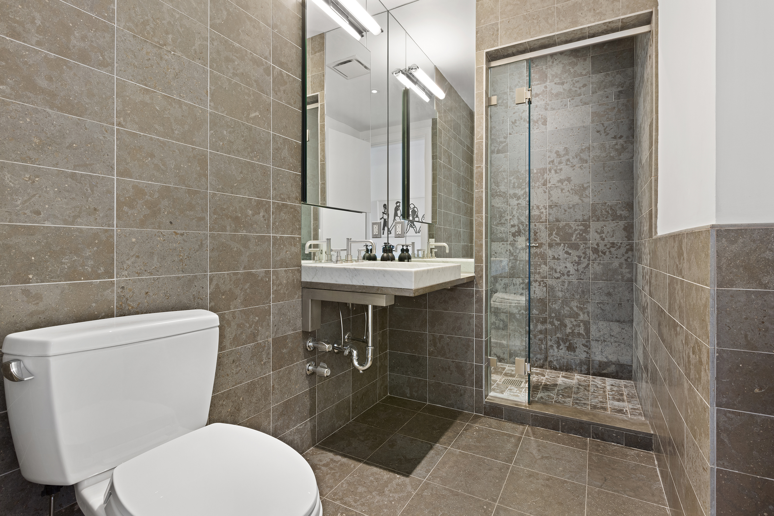 34 Leonard Street, Unit PH Manhattan, NY 10013 - Photo 13 of 30 a bathroom with a sink toilet and shower