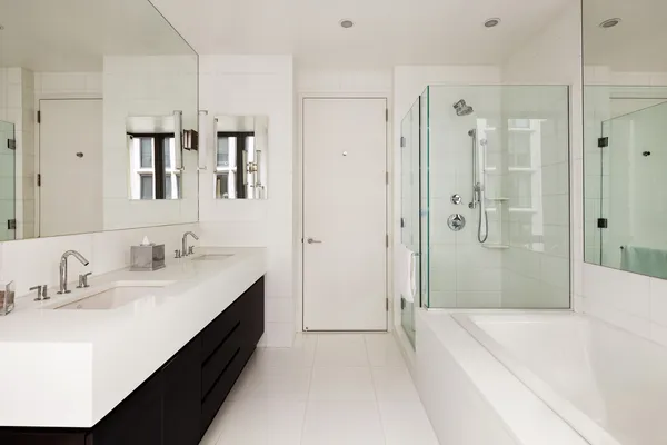 a spacious bathroom with a tub sink and shower