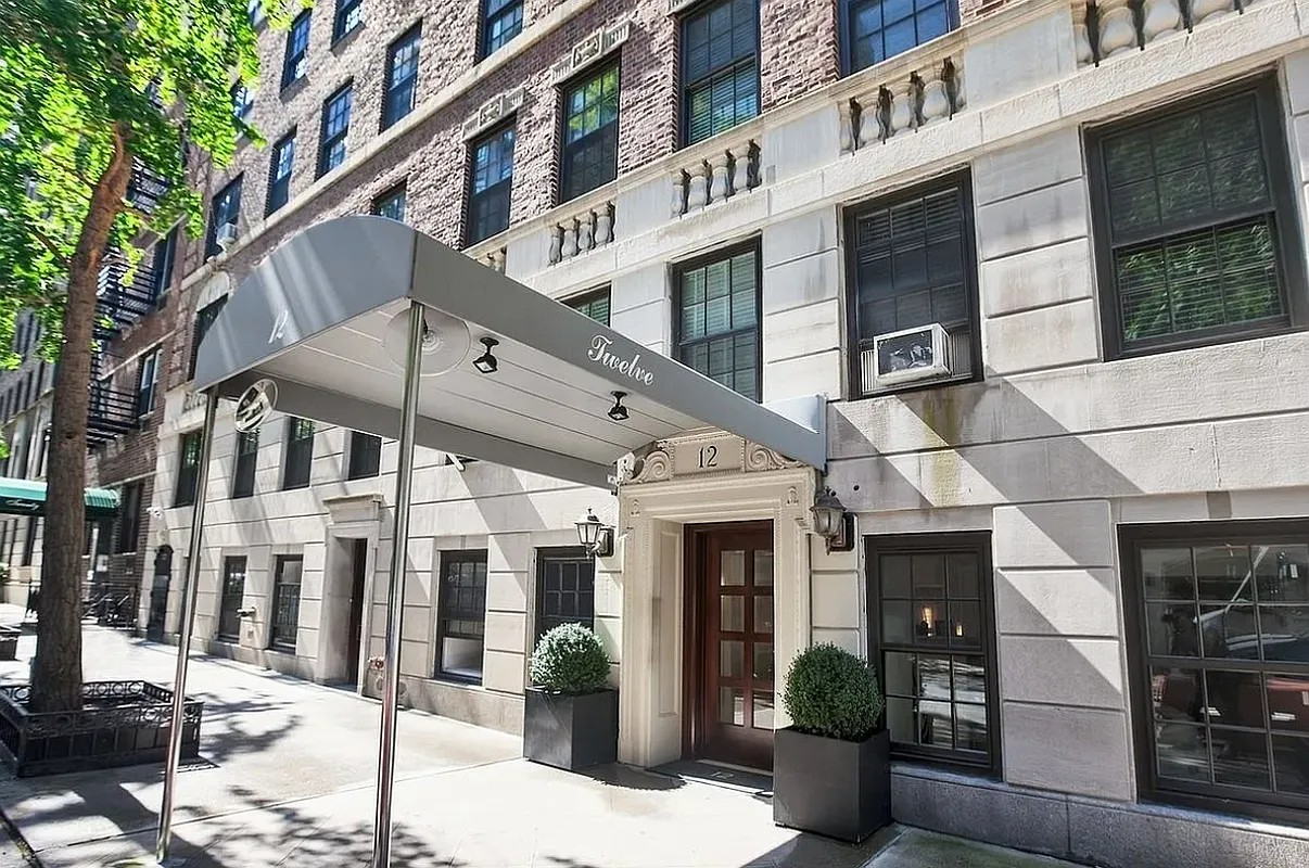 12 East 88th Street, Unit 6C Manhattan, NY 10128 - Photo 11 of 15 a view of a building with street