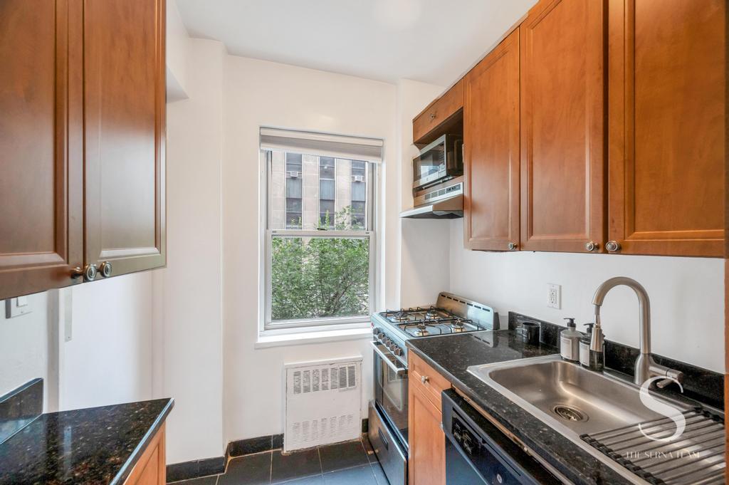 7 Lexington Avenue, Unit 5E Manhattan, NY 10010 - Photo 6 of 14 a kitchen with a sink and a window