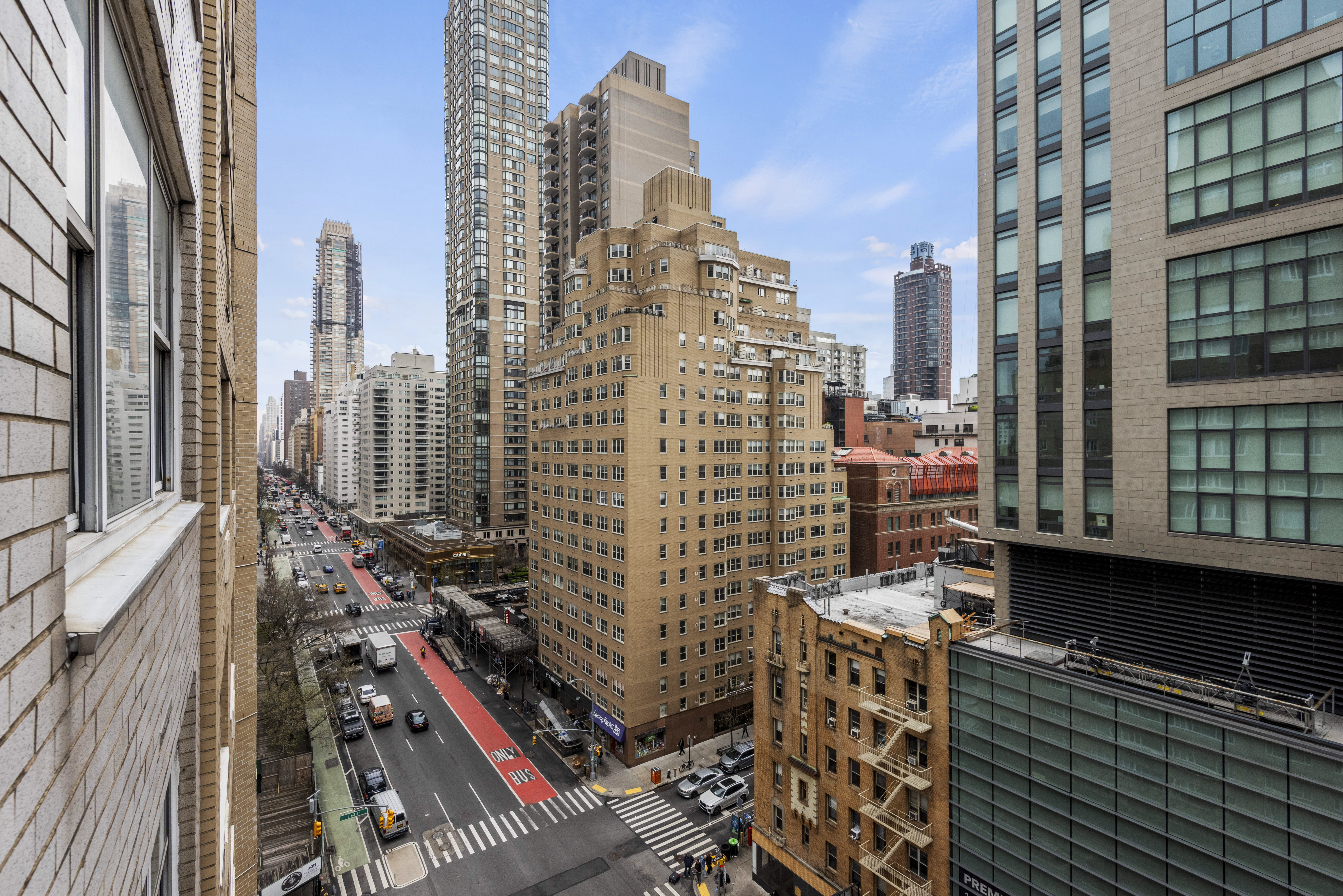 175 East 62nd Street, Unit 12A Manhattan, NY 10065 - Photo 11 of 24 a city view with tall buildings