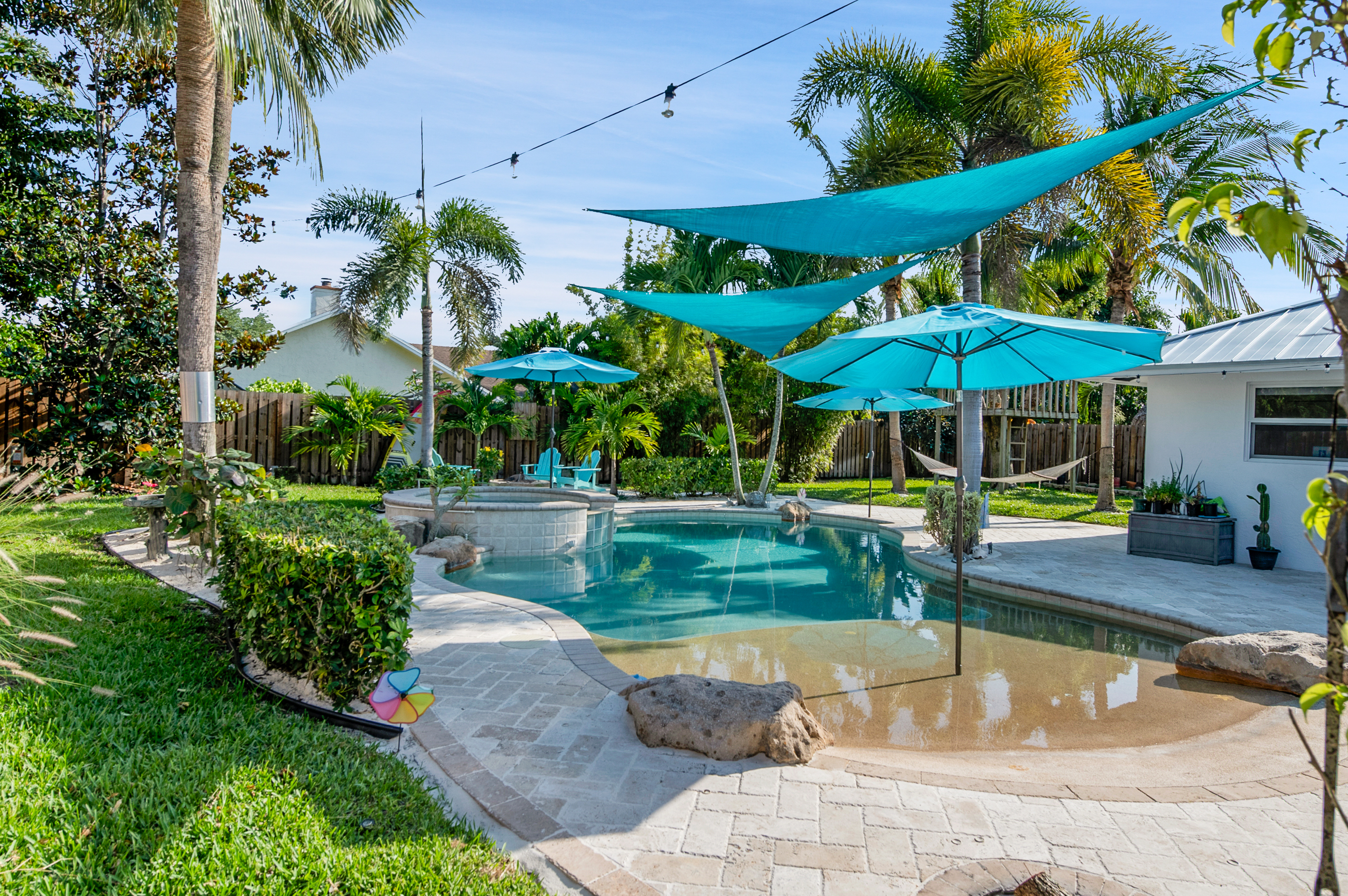 1560 Southwest 16th Street Boca Raton, FL 33486 - Photo 13 of 72 a view of a backyard with swimming pool and sitting area