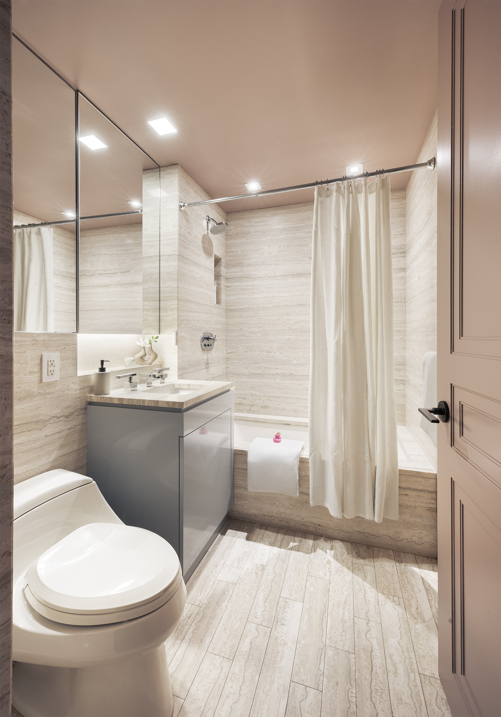 170 East End Avenue, Unit 2A Manhattan, NY 10128 - Photo 11 of 16 a bathroom with a sink a toilet and shower