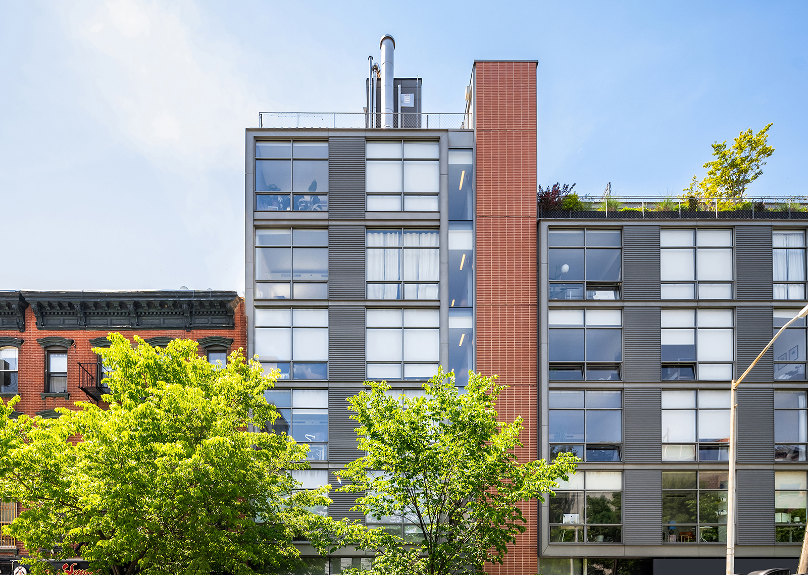 280 Metropolitan Avenue, Unit 3E Brooklyn, NY 11211 - Photo 6 of 12 a front view of a building with a garden