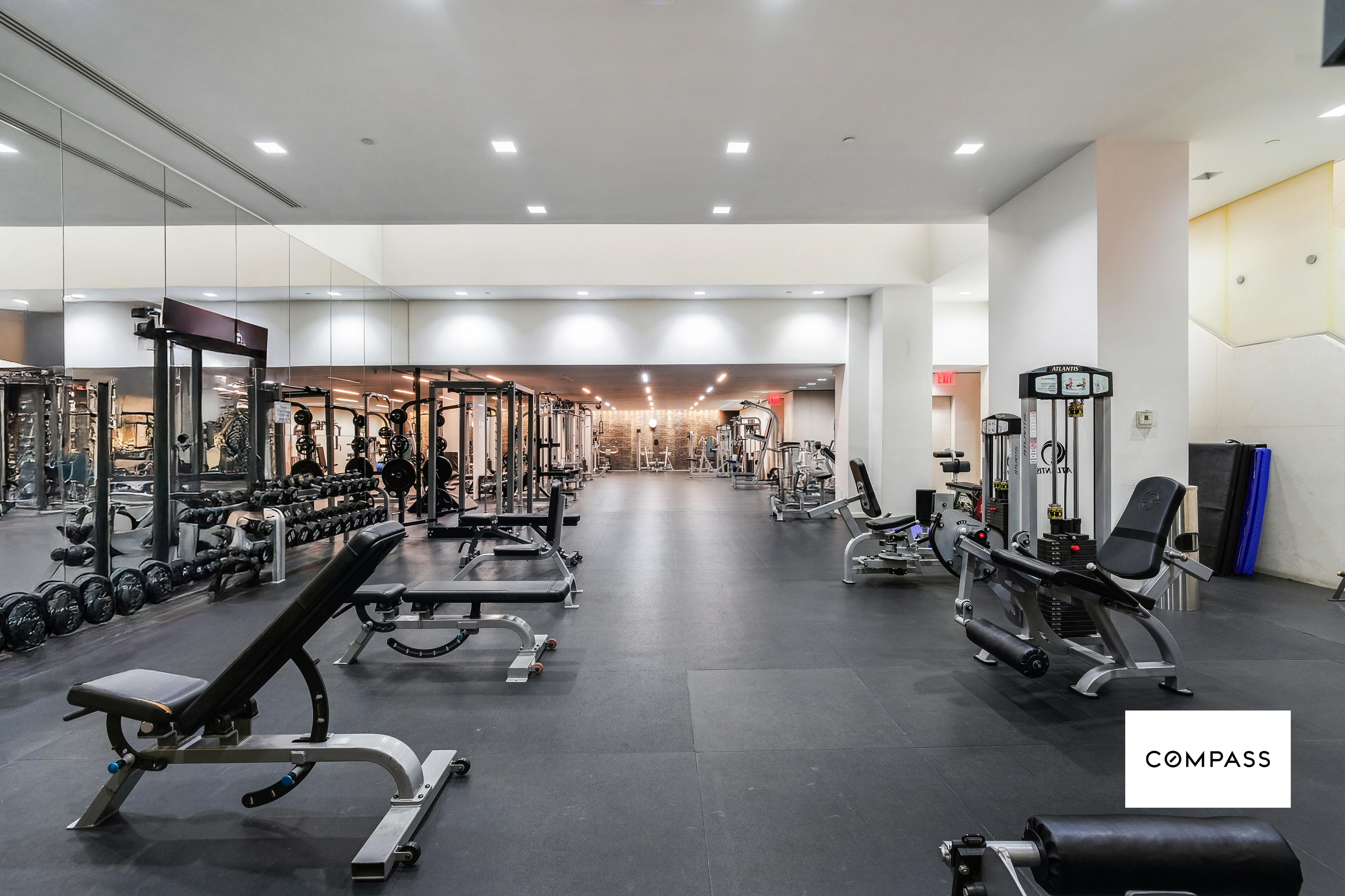 400 East 67th Street, Unit 7B Manhattan, NY 10065 - Photo 9 of 14 a view of a room with gym equipment