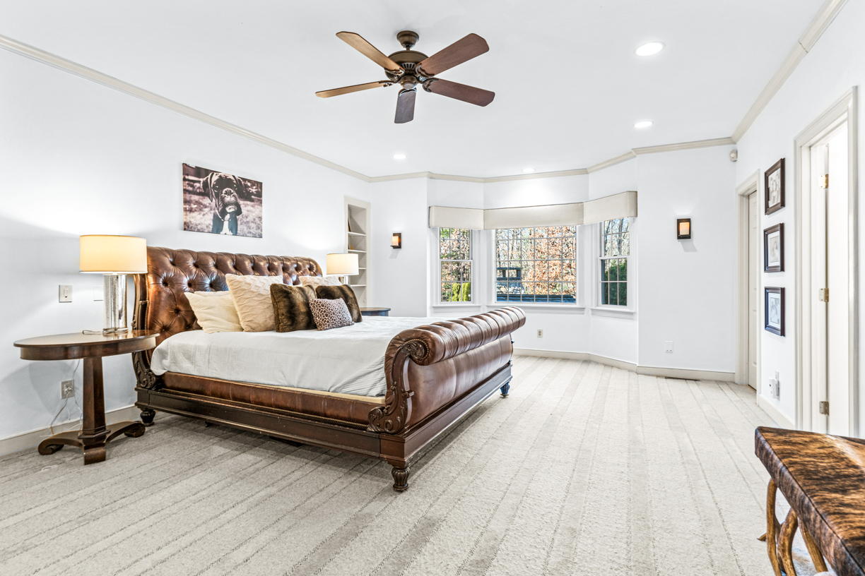 165 Bridle Trail Road Needham, MA 02492 - Photo 7 of 21 a bedroom with a bed and a chandelier