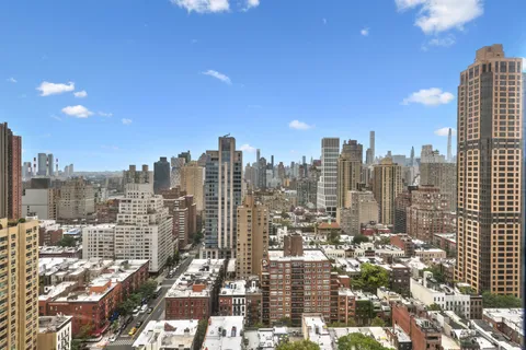 a view of a city with tall buildings