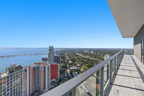 a view of city and mountain from a balcony