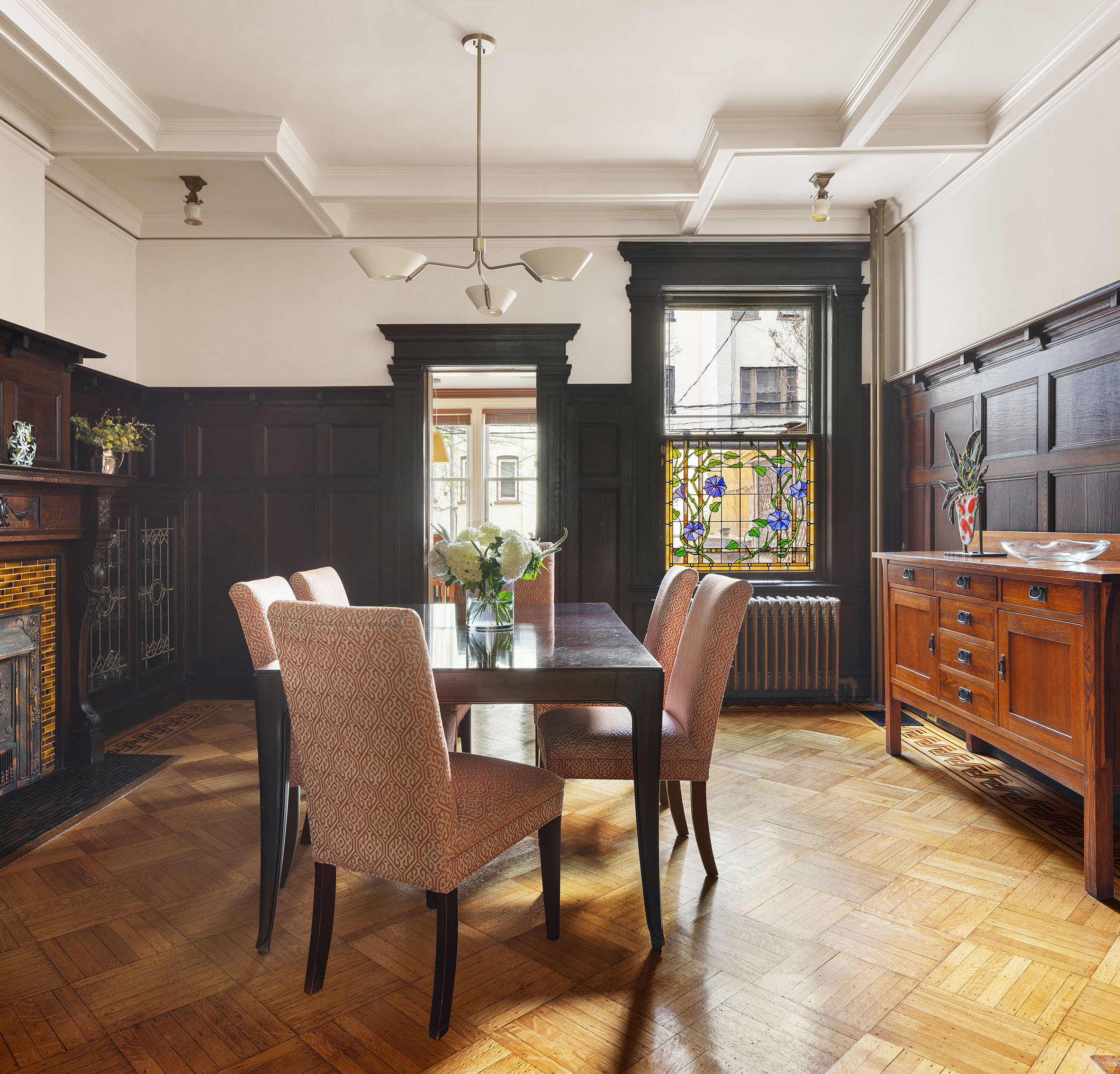 577 4th Street Brooklyn, NY 11215 - Photo 5 of 22 a dining room with furniture a chandelier and window