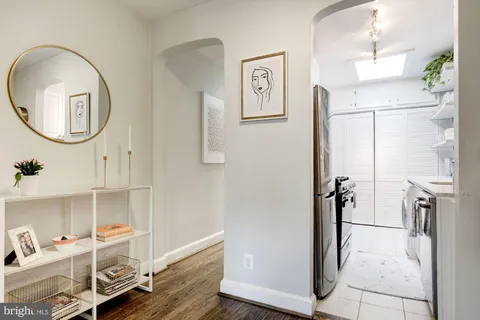 a kitchen with a sink and a stove top oven