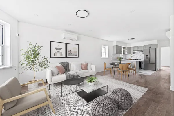 a living room with furniture and a table