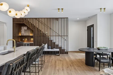a kitchen with a sink appliances and cabinets