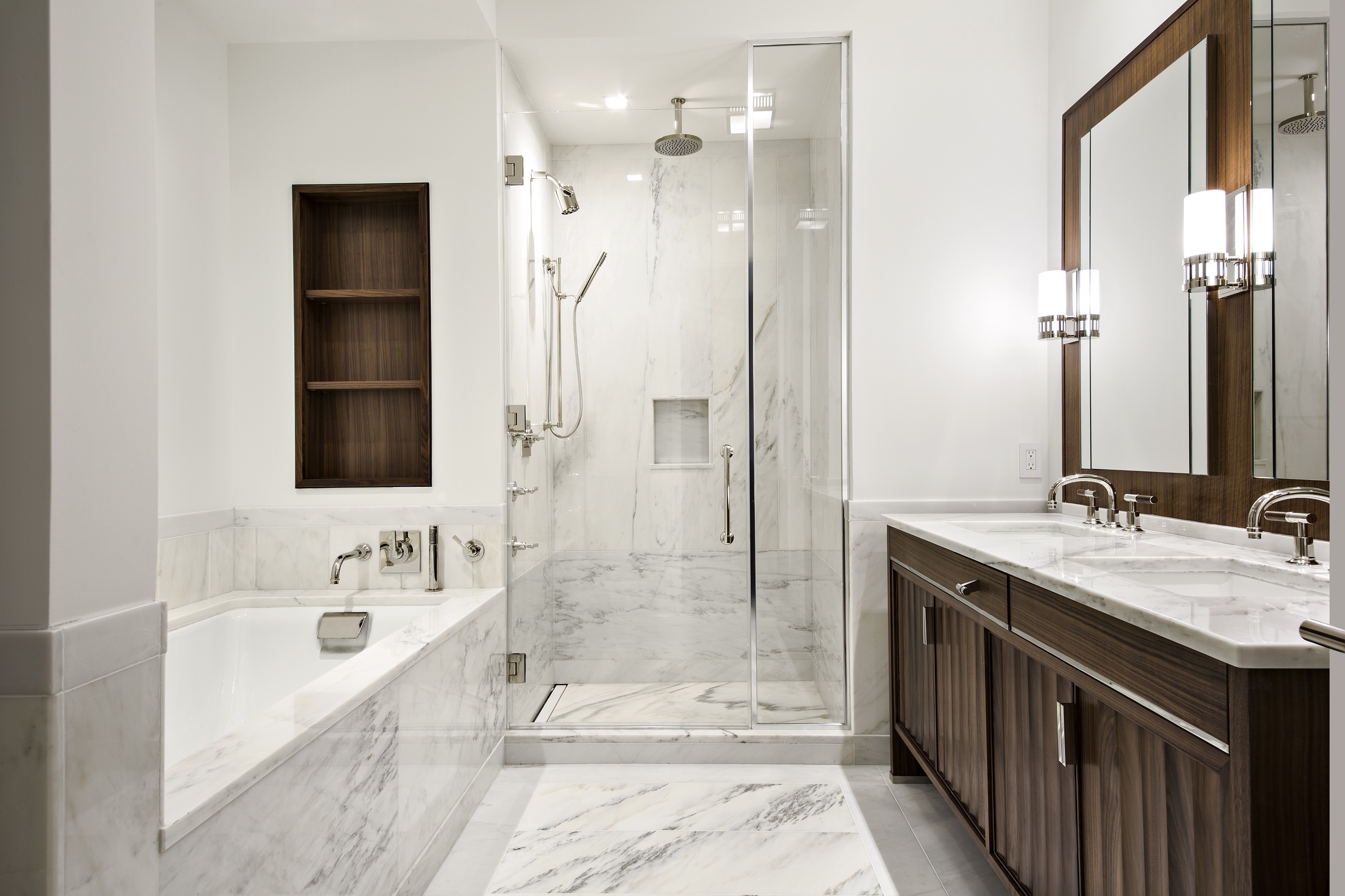 150 Charles Street, Unit 3BN Manhattan, NY 10014 - Photo 5 of 12 a bathroom with a tub sink shower and mirror