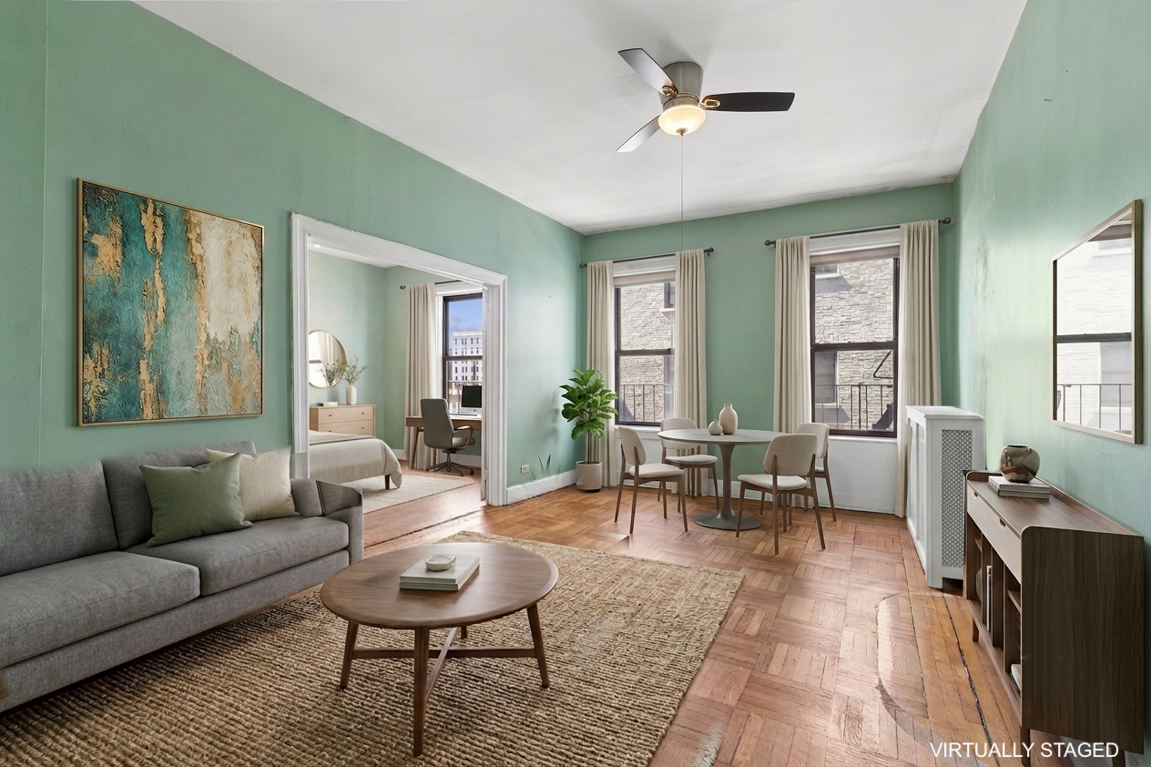 15 Fort Washington Avenue, Unit 4E Manhattan, NY 10032 - Photo 1 of 8 a living room with furniture and a large window