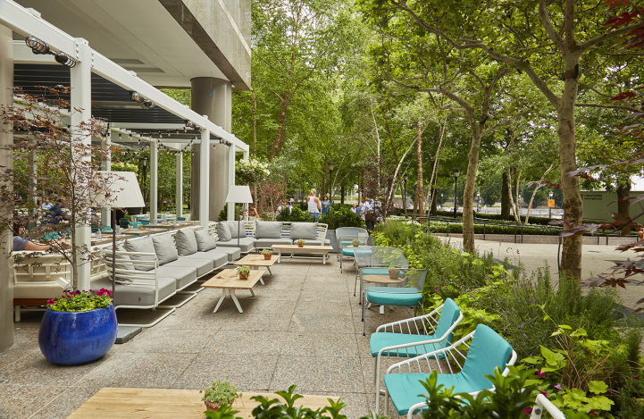 30 West Street, Unit 10A Manhattan, NY 10004 - Photo 13 of 16 a view of a patio with couches table and chairs and potted plants