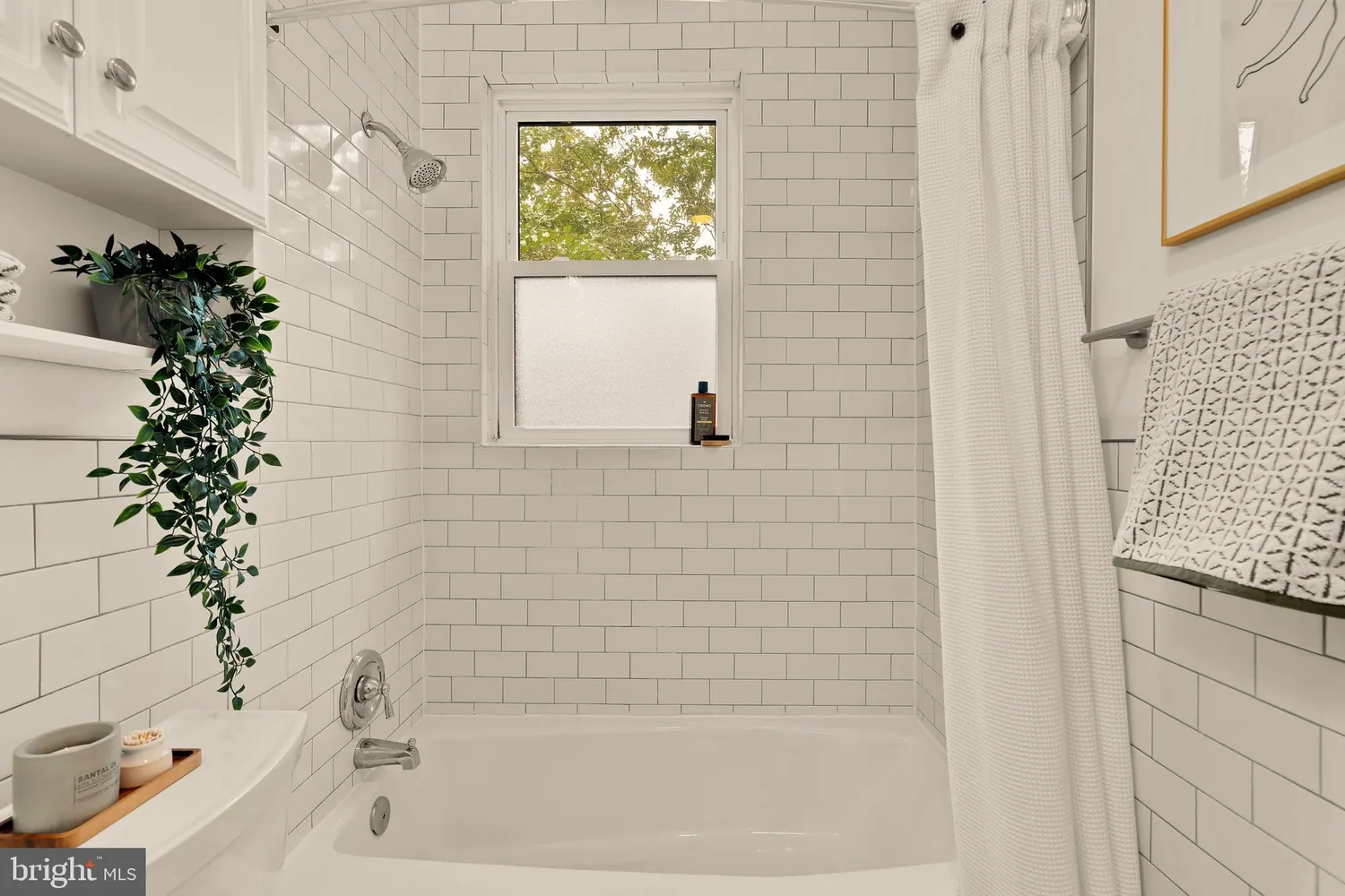 a bathroom with a bathtub and shower