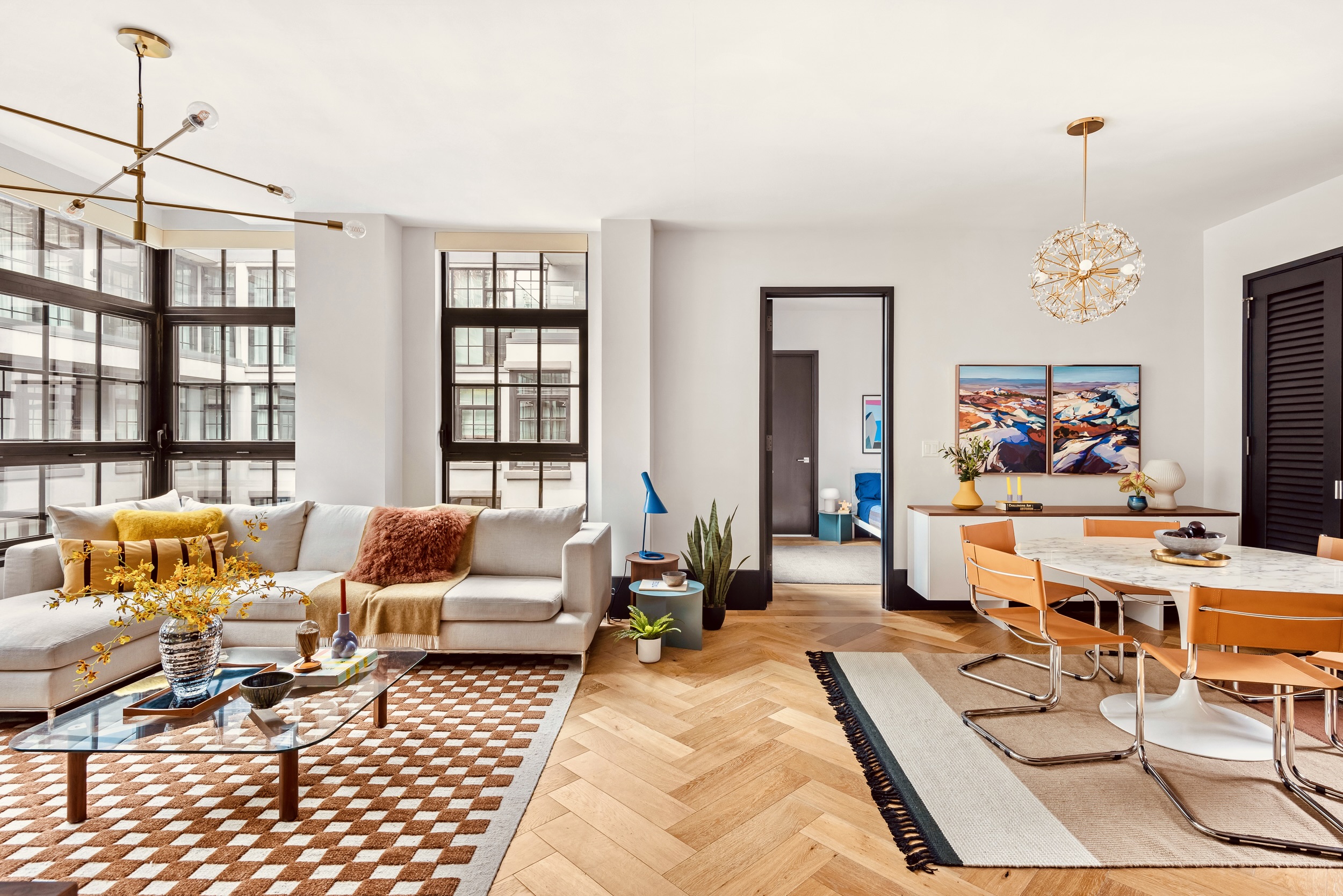 51 Jay Street, Unit 5J Brooklyn, NY 11201 - Photo 2 of 15 a living room with furniture and a chandelier