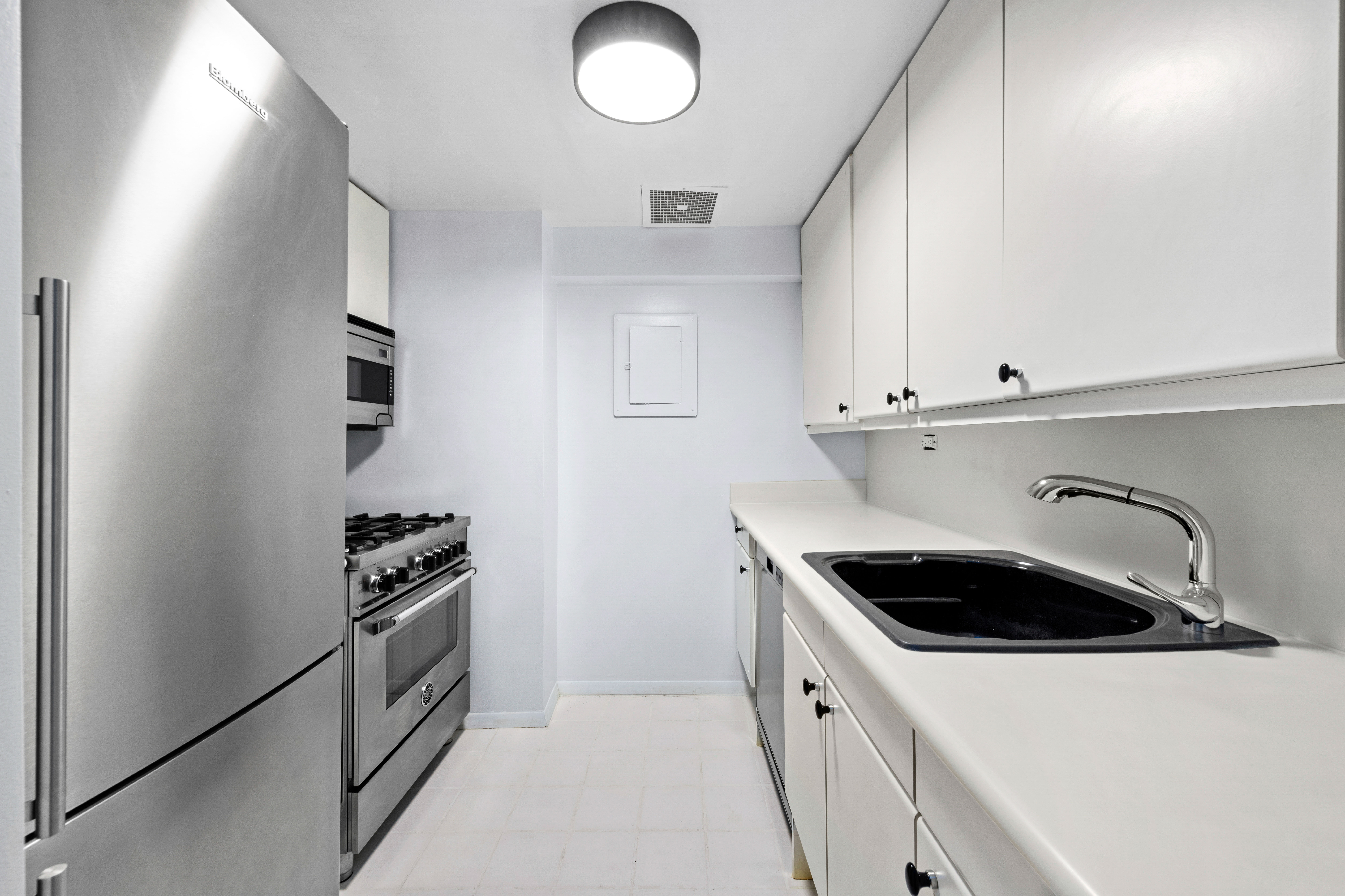 106 Central Park South, Unit 2F Manhattan, NY 10019 - Photo 5 of 13 a kitchen with sink and cabinets