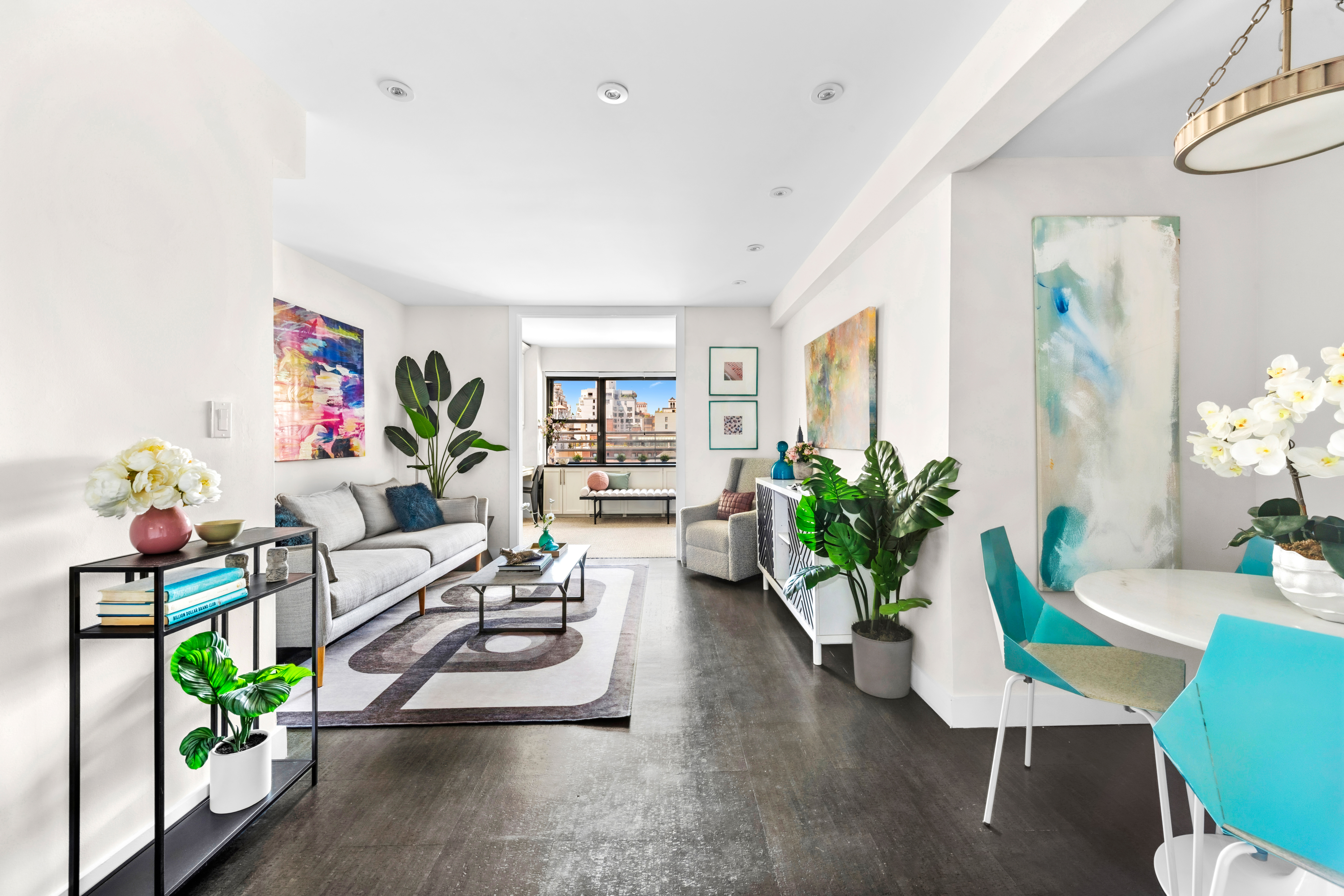 196 East 75th Street, Unit 16G Manhattan, NY 10021 - Photo 2 of 10 a living room with furniture potted plant and a window