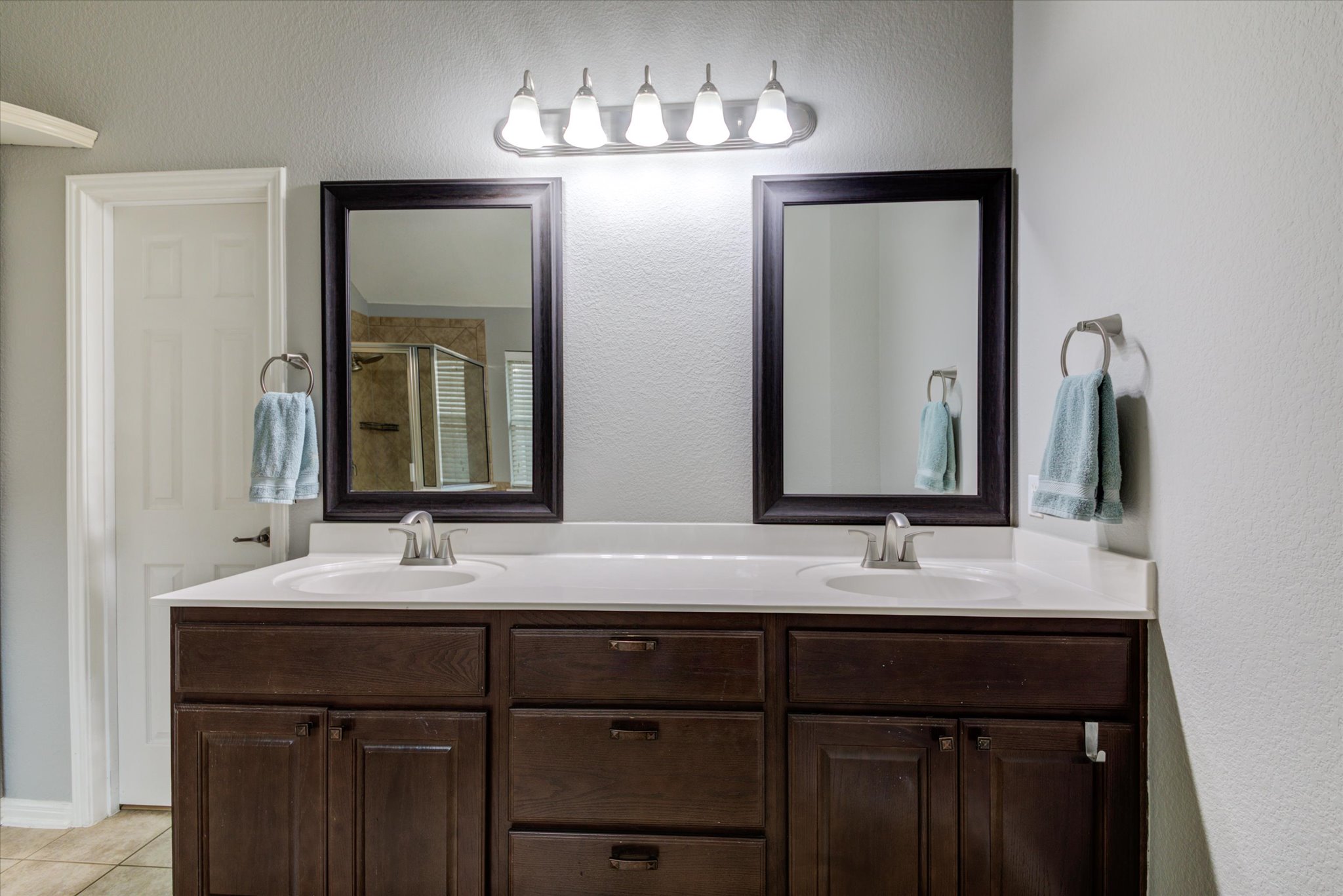 5412 Batak Lane Austin, TX 78749 - Photo 29 of 40 a bathroom with a double vanity sink and a mirror