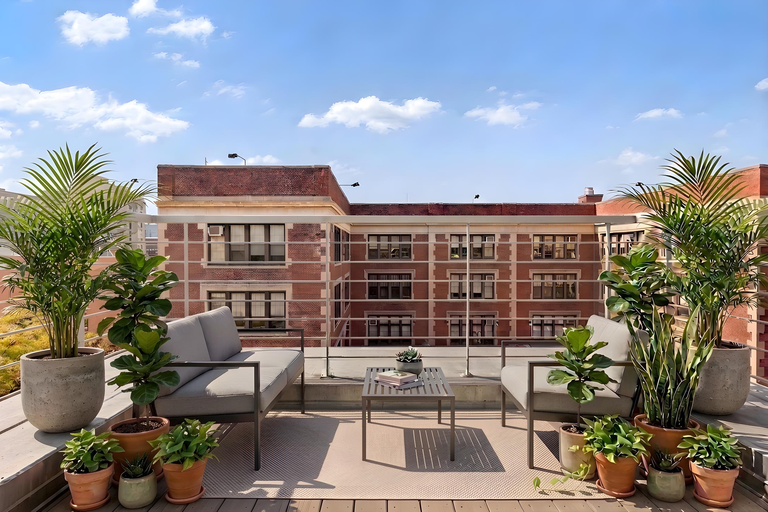 335 Warren Street, Unit 401 Brooklyn, NY 11201 - Photo 12 of 15 a view of a patio with table and chairs and potted plants