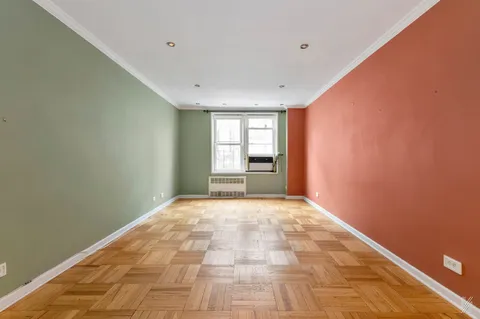 a view of an empty room and a window