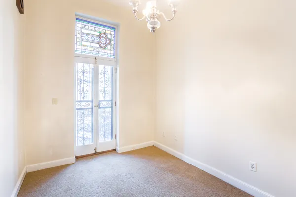 an empty room with windows