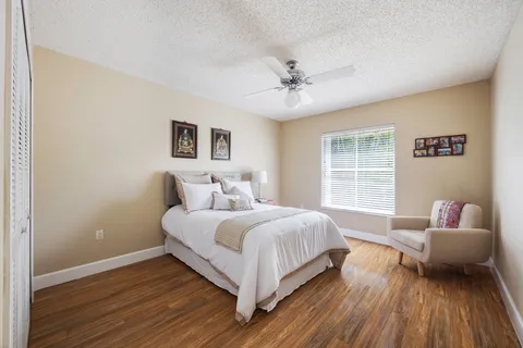 a bedroom with a bed and a couch