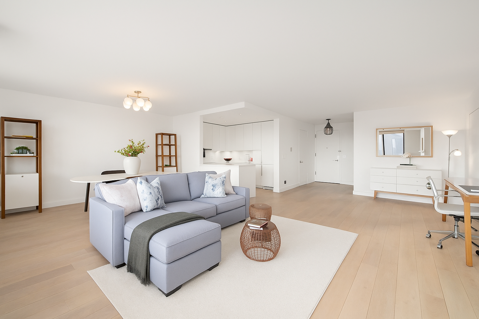 22 West 15th Street, Unit 19D Manhattan, NY 10011 - Photo 3 of 18 a living room with furniture and a wooden floor