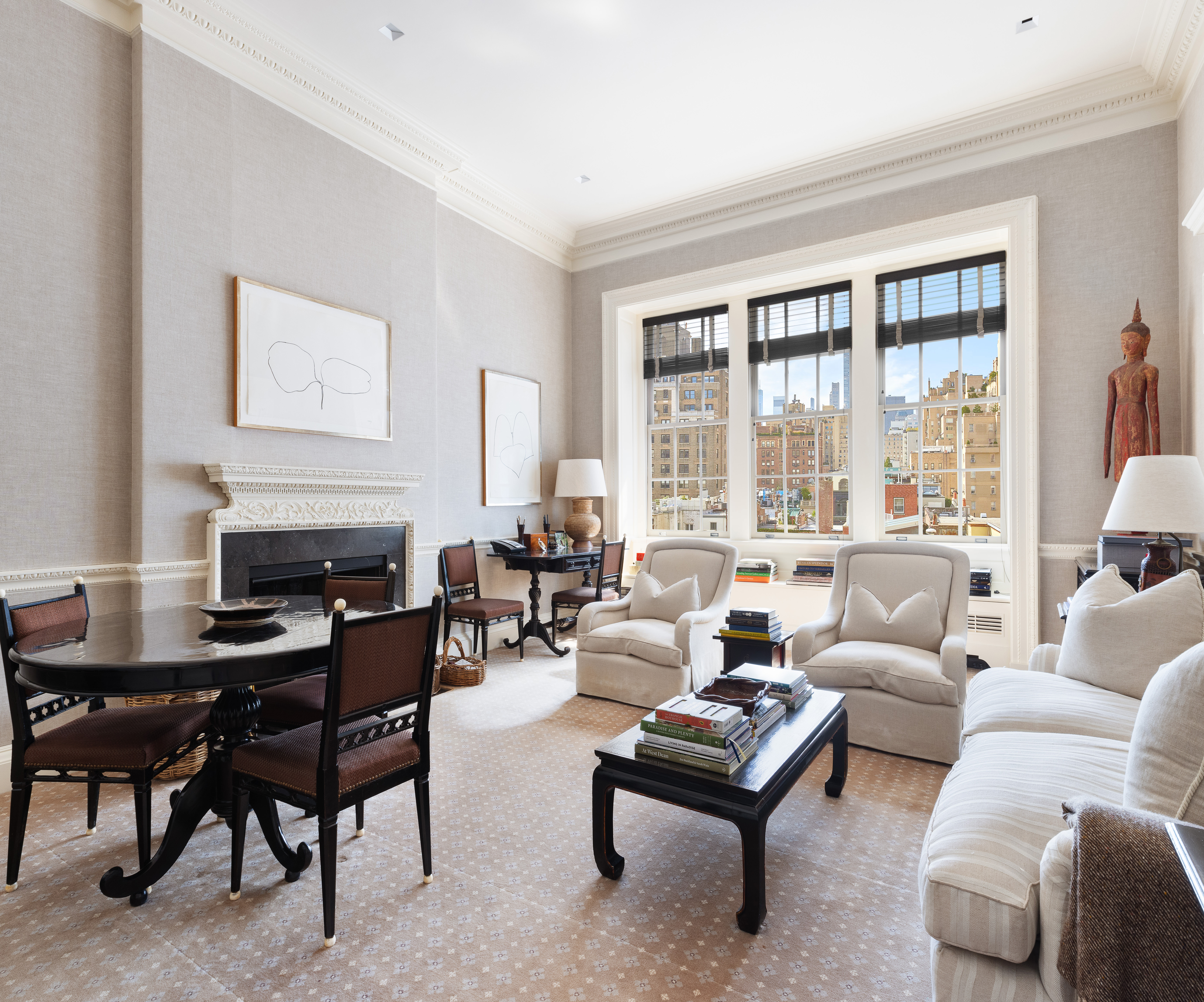 960 5th Avenue Manhattan, NY 10075 - Photo 12 of 13 a living room with furniture and a fireplace